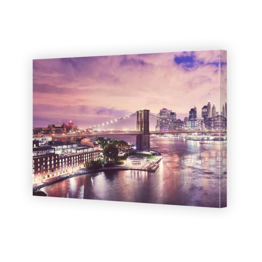 Dumbo neighborhood and the Brooklyn Bridge at night, color toned picture, New York City, USA.