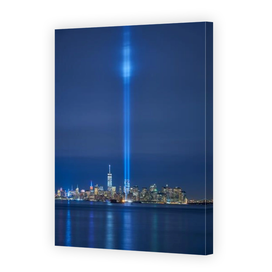 New York City skyline with skyscrapers and the two beams of the Tribute in Light. Lower Manhattan, Financial District, New York Harbor