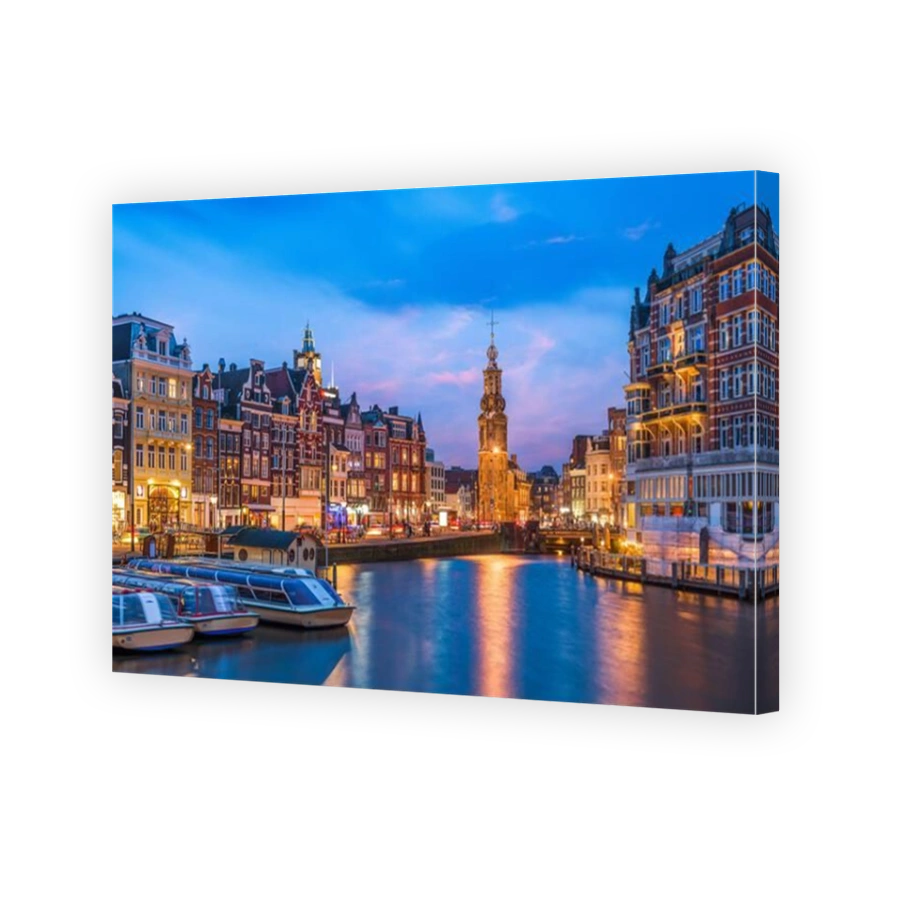 Amsterdam, Netherlands cityscape on the canals at twilight with Munttoren Tower.