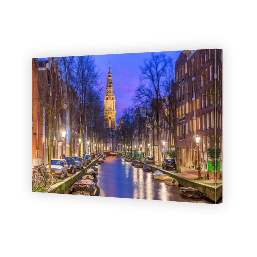 Amsterdam, Netherlands cityscape on the canals at twilight with Zuiderkerk Church.