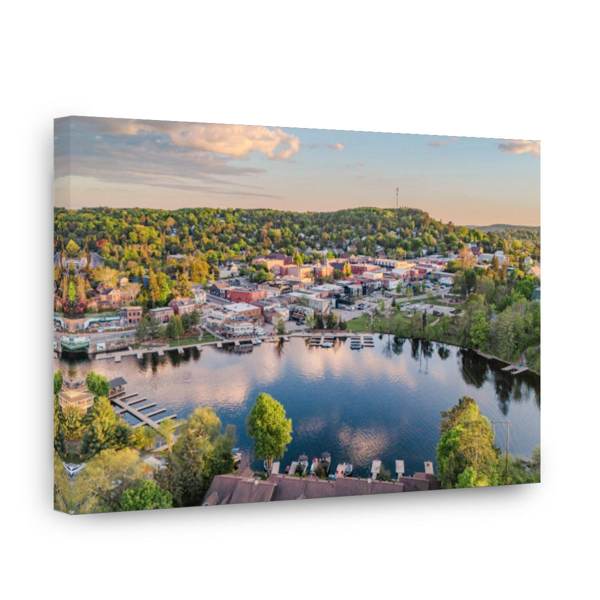 Aerial view of a picturesque town with a serene lake.