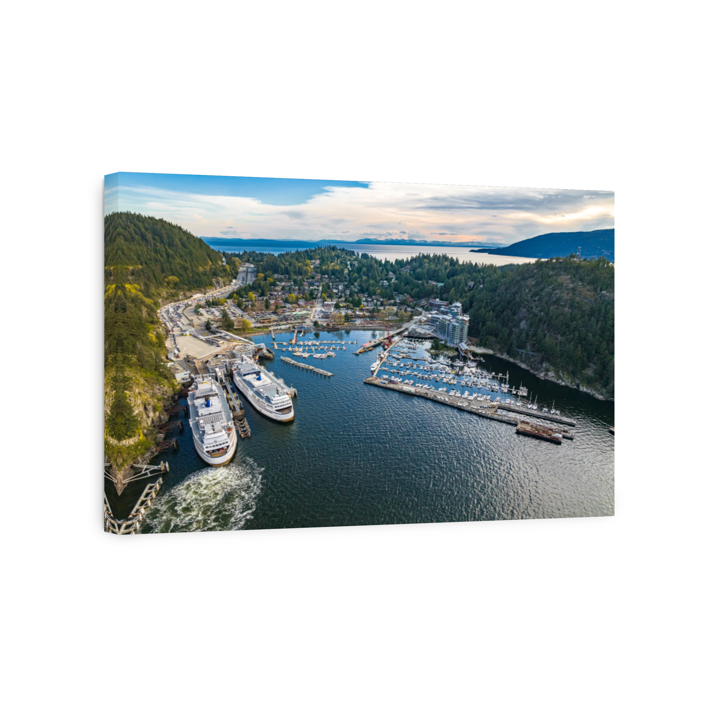 Aerial shot of the city, dense forest and moored boats and ferries at the harbor of Horseshoe Bay