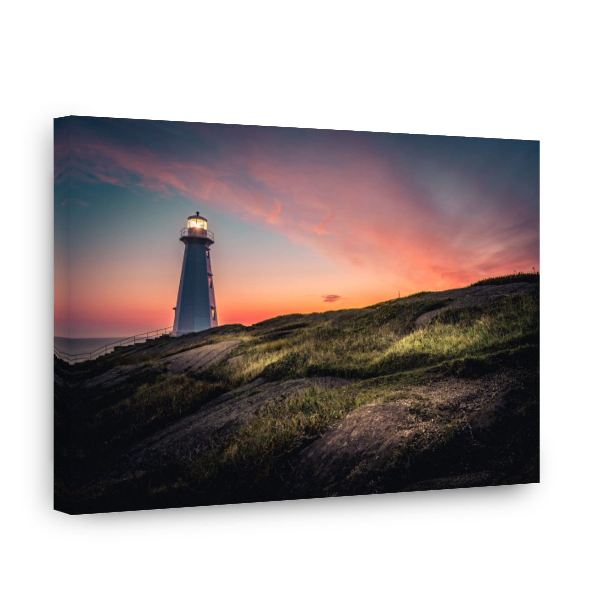 Breathtaking view of Cape Spear Lighthouse on colorful sky background during sunrise
