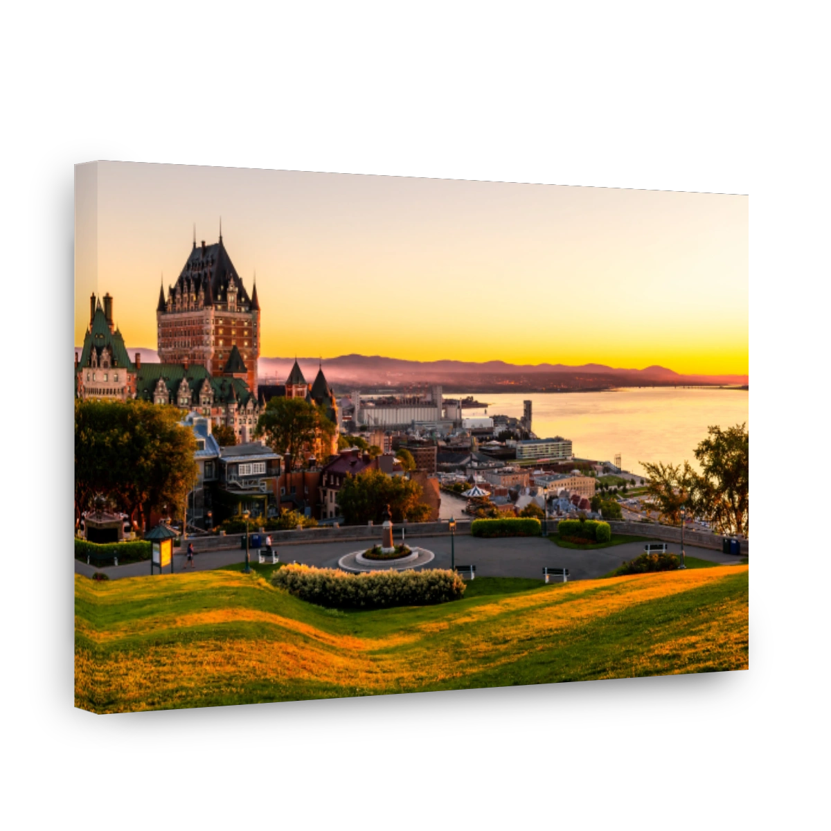 Beautiful view of the Chateau Frontenac surrounded by greenery in Quebec, Canada at sunrise
