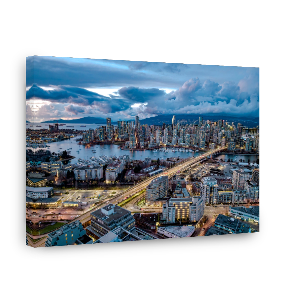 Vancouver skyline at dusk with dramatic sky.