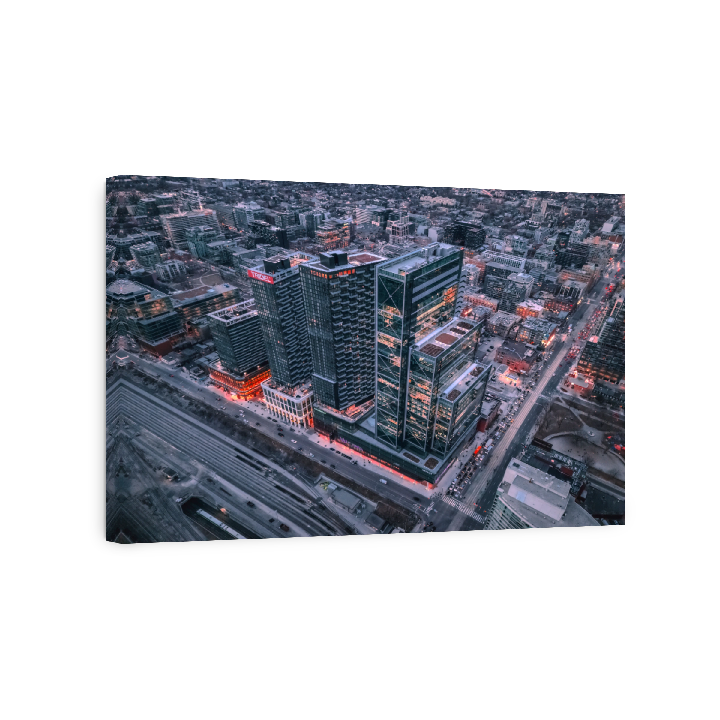 Aerial view of city skyscrapers at dusk.