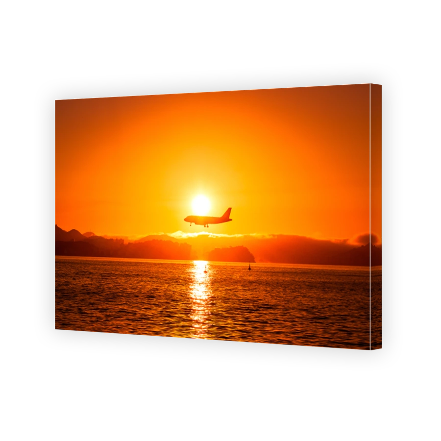 Airplane Above Water by Sunset