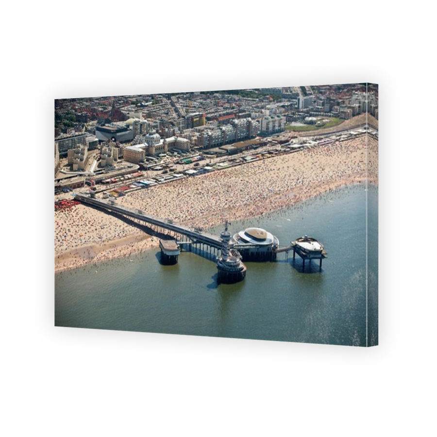 The Netherlands, Scheveningen, The Hague or in Dutch. Events center called De Pier. People sunbathing on the beach. Aerial.