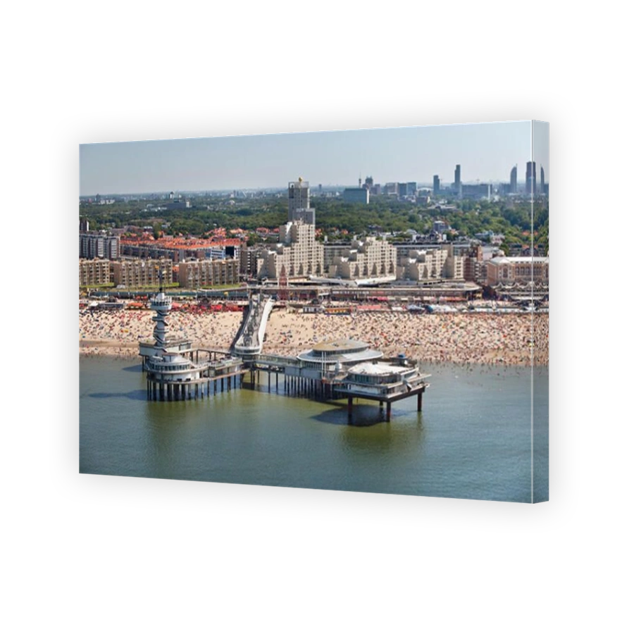 The Netherlands, Scheveningen, near The Hague or Den Haag. Events center called De Pier. People sunbathing on the beach. Summertime. Aerial.