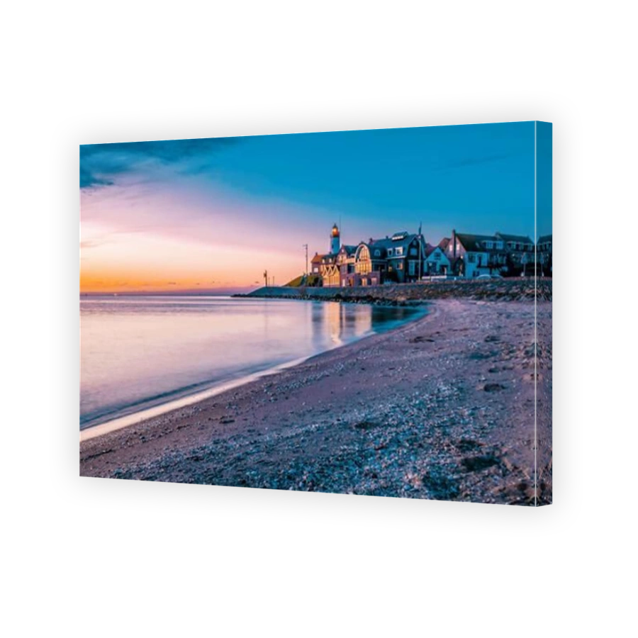 sunset at the lighthouse and harbor of Urk Holland. Fishing village Urk. Beautiful sunset during the evening in Urk Flevoland Netherlands