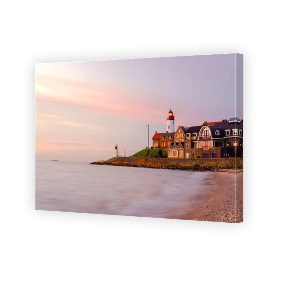 Urk Flevoland Netherlands, harbor with the lighthouse on a bright summer in the Netherlands at the historical village of Urk alongside the lake Ijsselmeer Europe