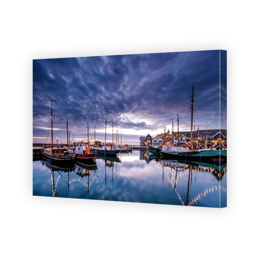 Urk village during sunset, Urk Flevoland Netherlands lighthouse and harbor lights during winter at the former Island of Urk