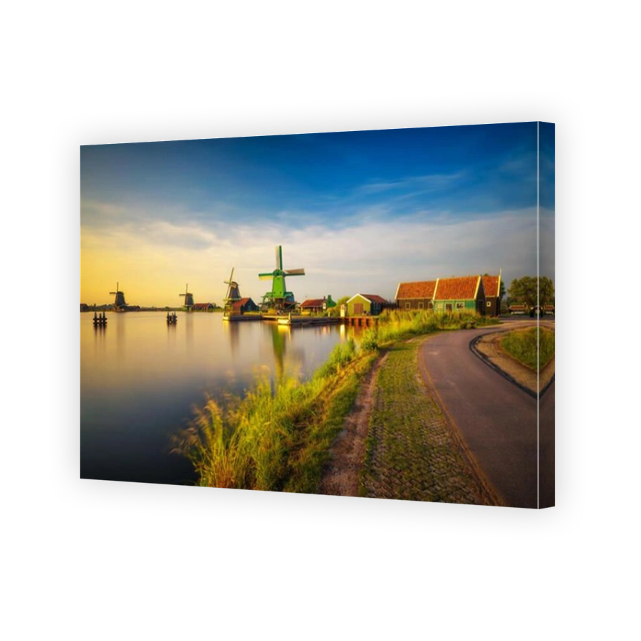 Sunset above farm houses and windmills of Zaanse Schans in the Netherlands
