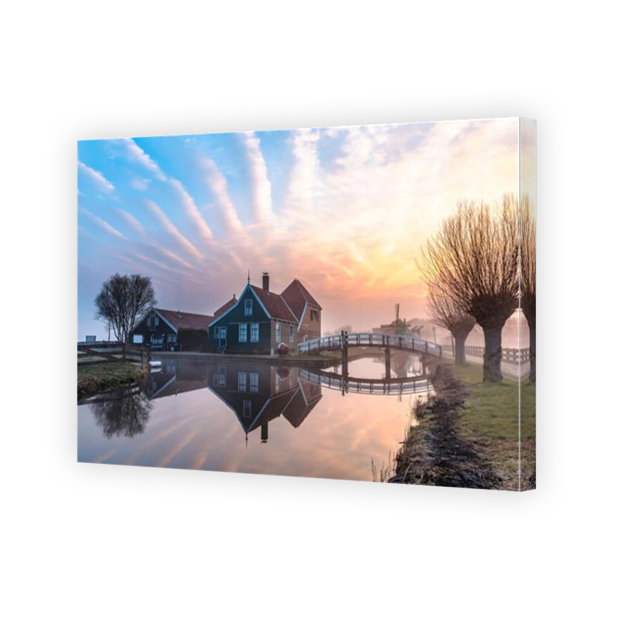 Beautiful and typical Dutch wooden houses architecture mirrored on the calm canal of Zaanse Schans located at the North of Amsterdam, Netherlands