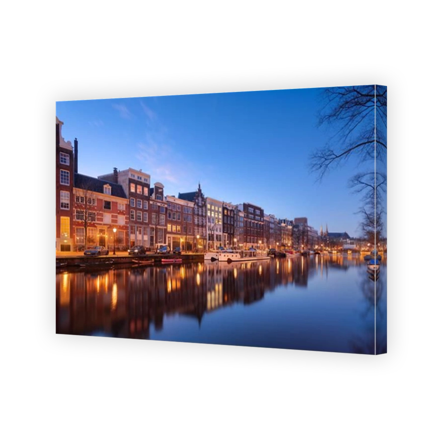 Amsterdam, Netherlands bridges and canals at twilight.