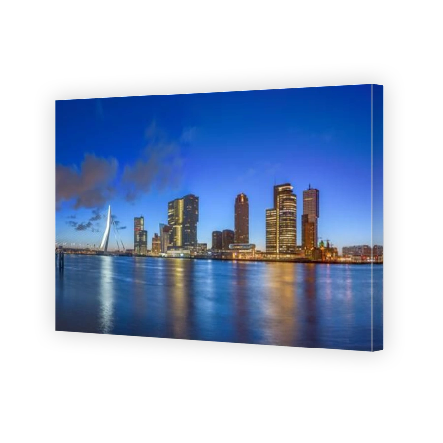 Rotterdam, Netherlands, city skyline on the river at twilight.