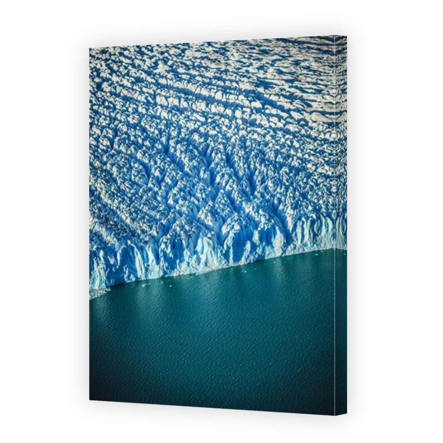 Aerial view of glacier's edge and water