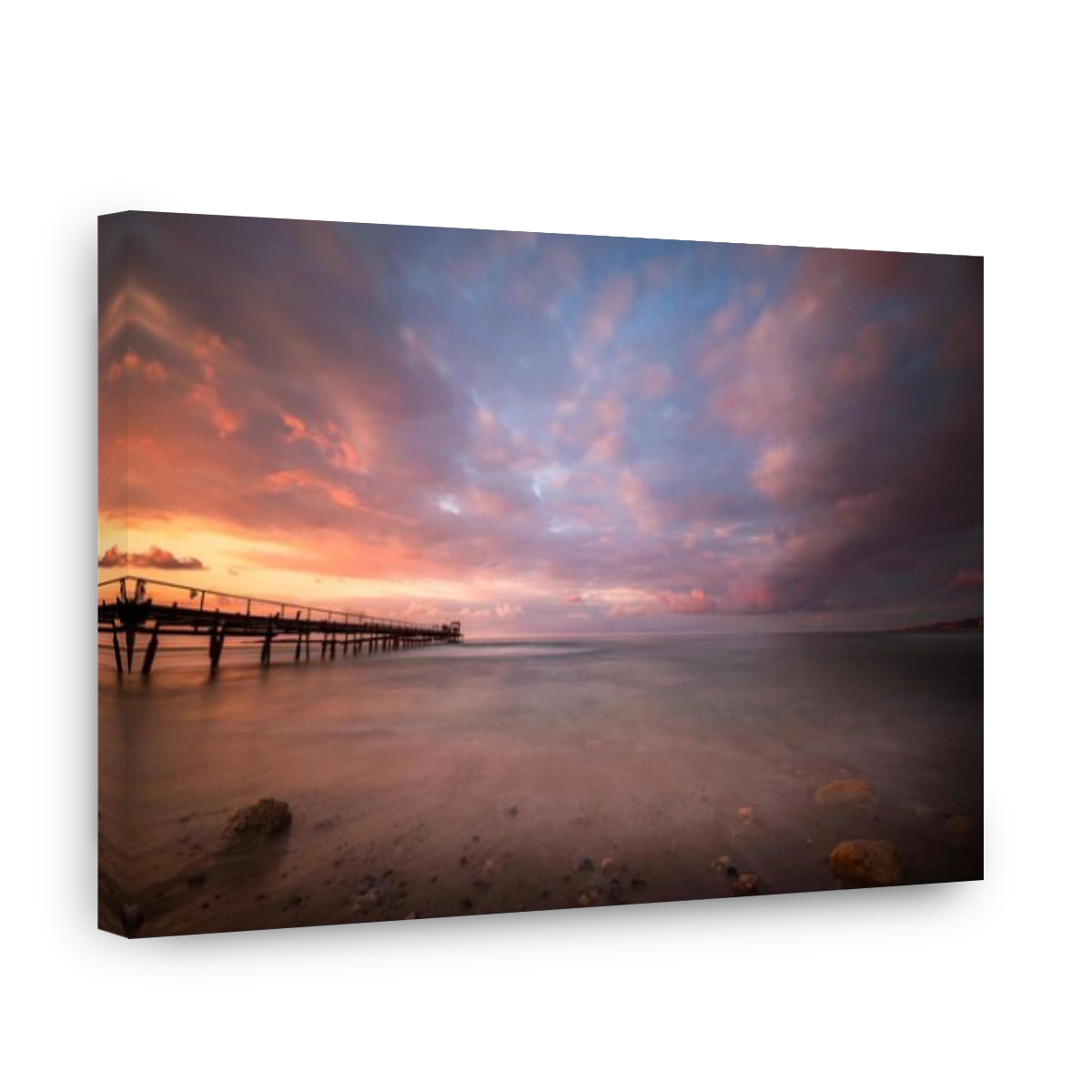 sunset at Atlit beach with a old woden pier, Israel