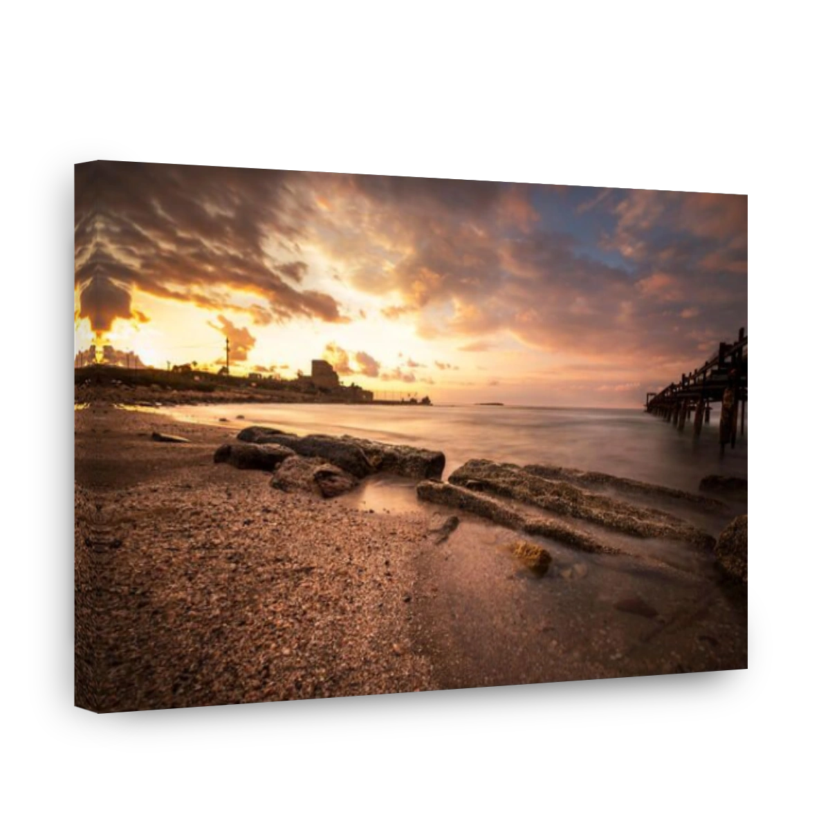 sunset at Atlit beach with a old woden pier, Israel