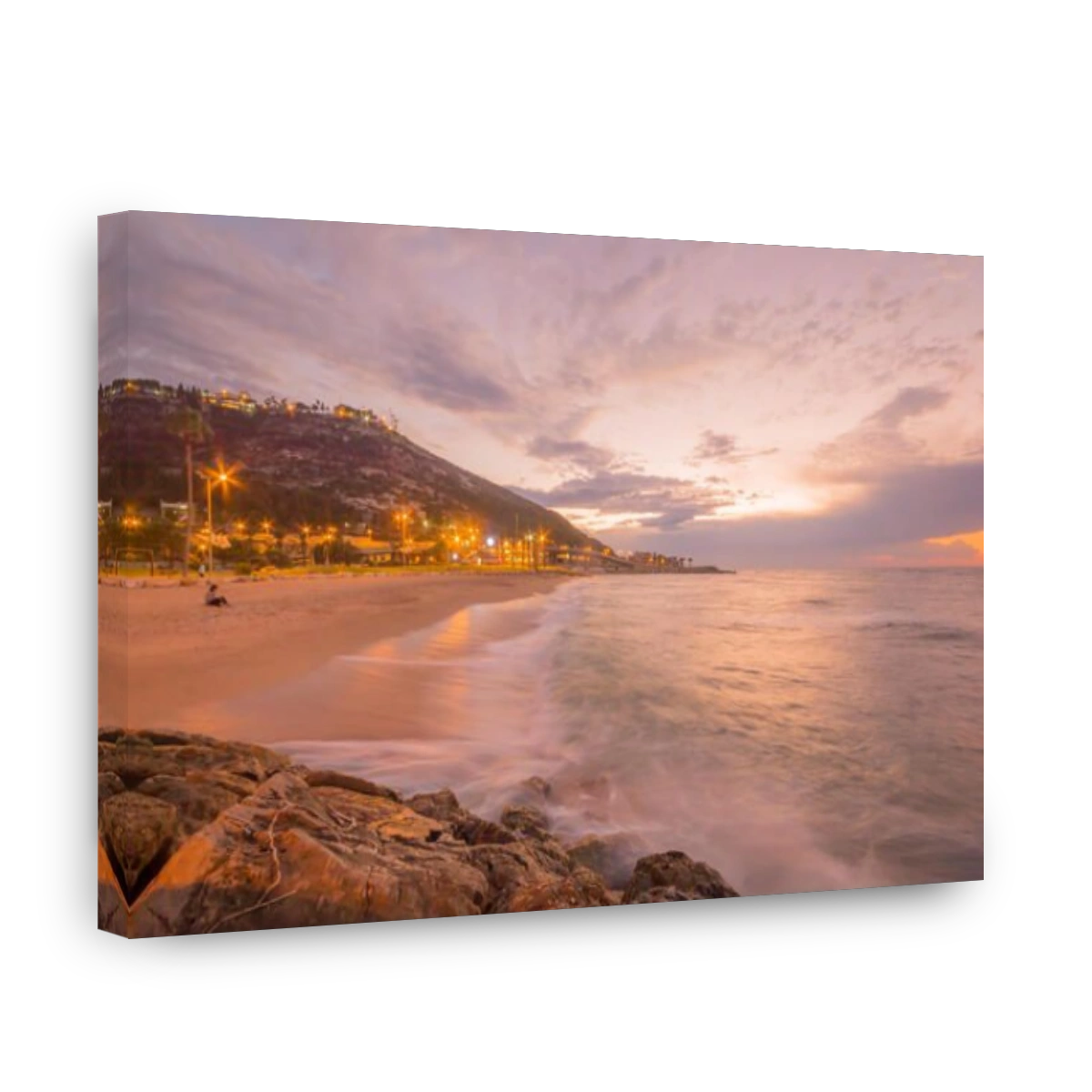 Sunset view of the Bat-Galim beach and the Carmel mountain, in Haifa, Israel
