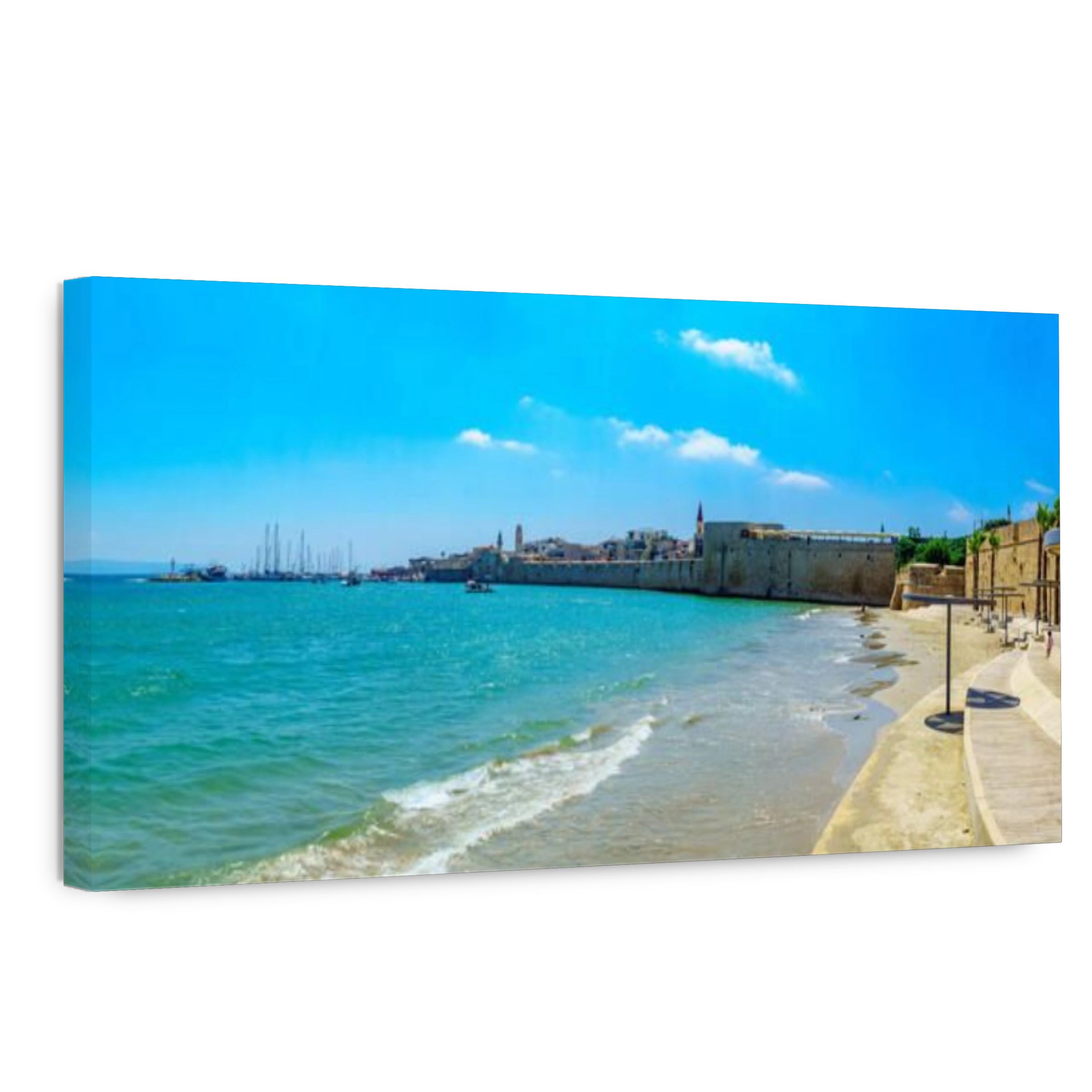 Acre, Israel - July 08, 2019: Panoramic view of the Horses beach, the sea wall and the fishing port, with locals and visitors, in the old city of Acre