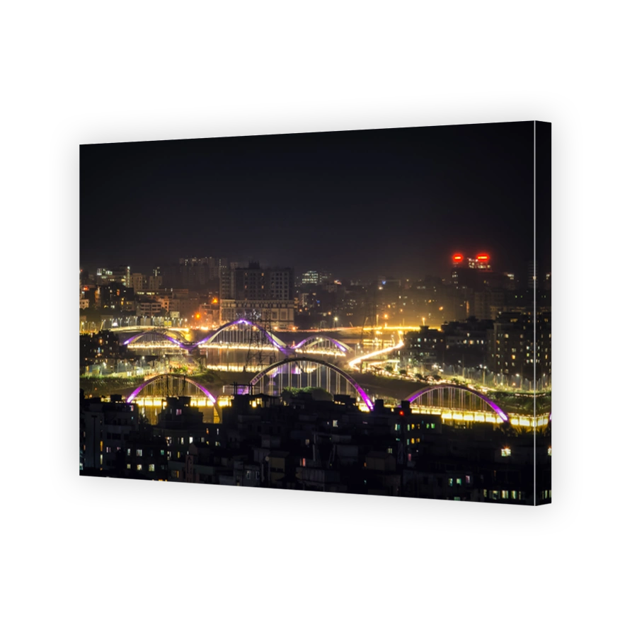 Illuminated Cityscape Against Sky At Night