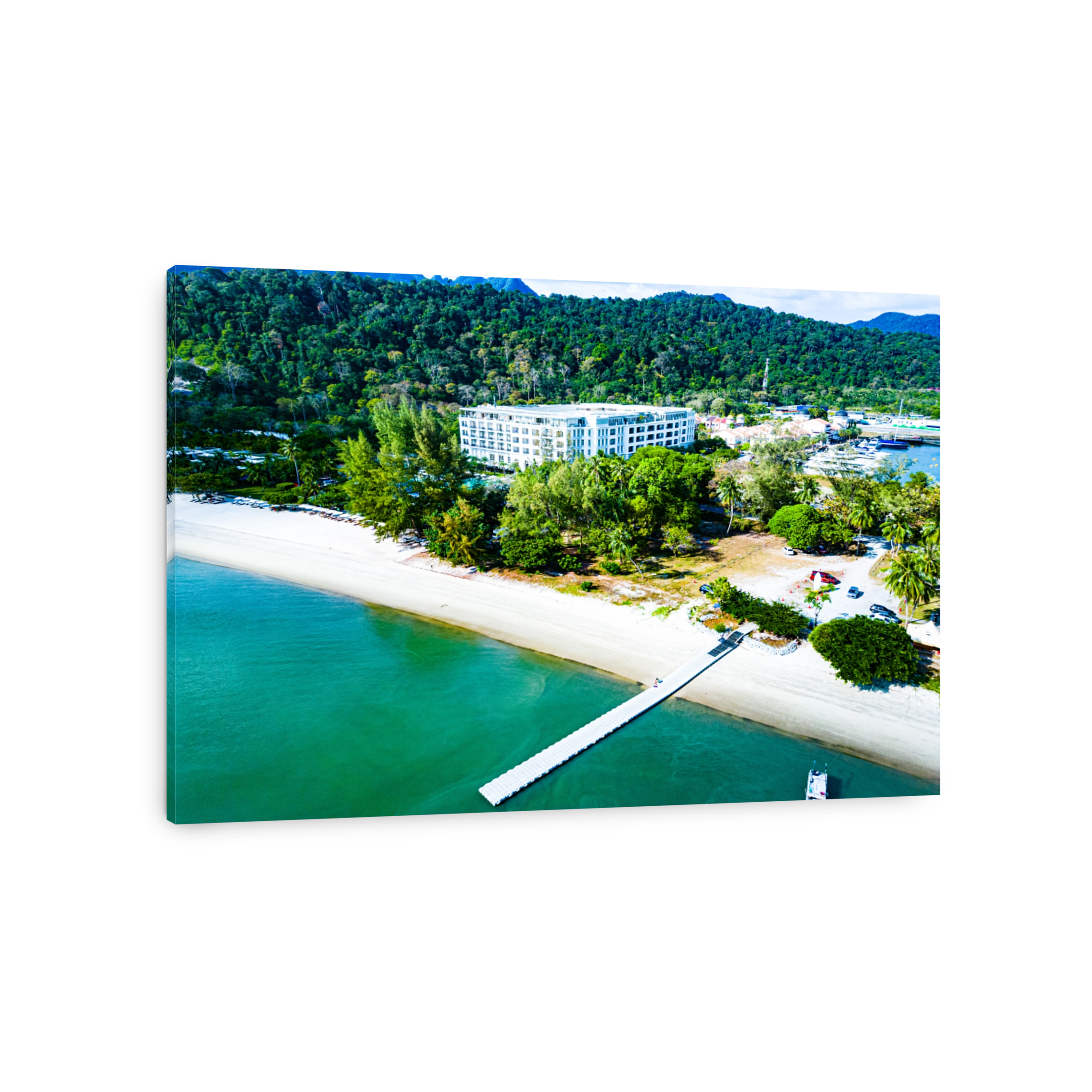 Sea coast with a sandy beach, pontoon and resort