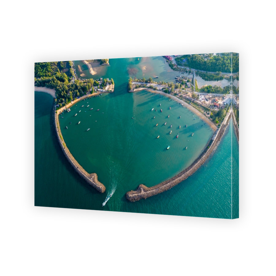 A Landscape Drone Shot Of Breakwater At Sunset