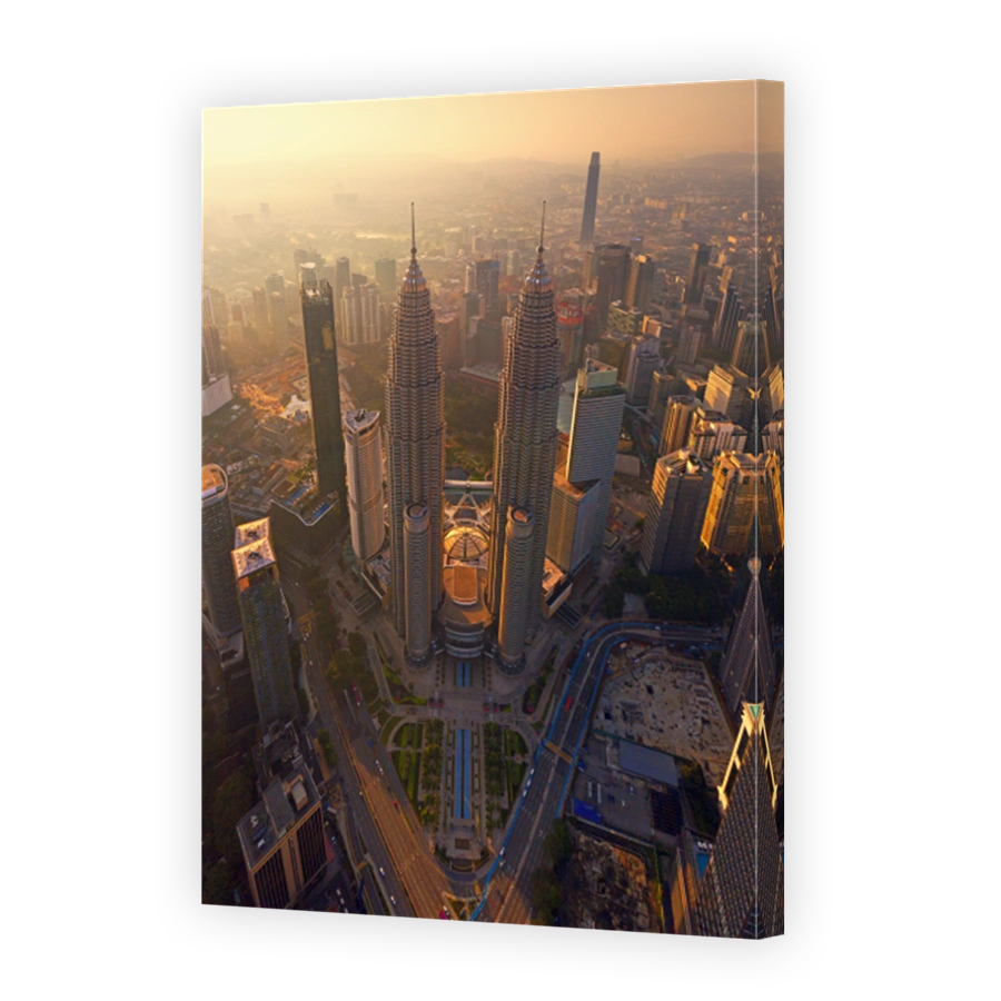 Top of Petronas Twin Towers. Aerial view of Kuala Lumpur Downtown, Malaysia. Financial district and business centers in smart urban city in Asia. Skyscraper and high-rise buildings at sunset.