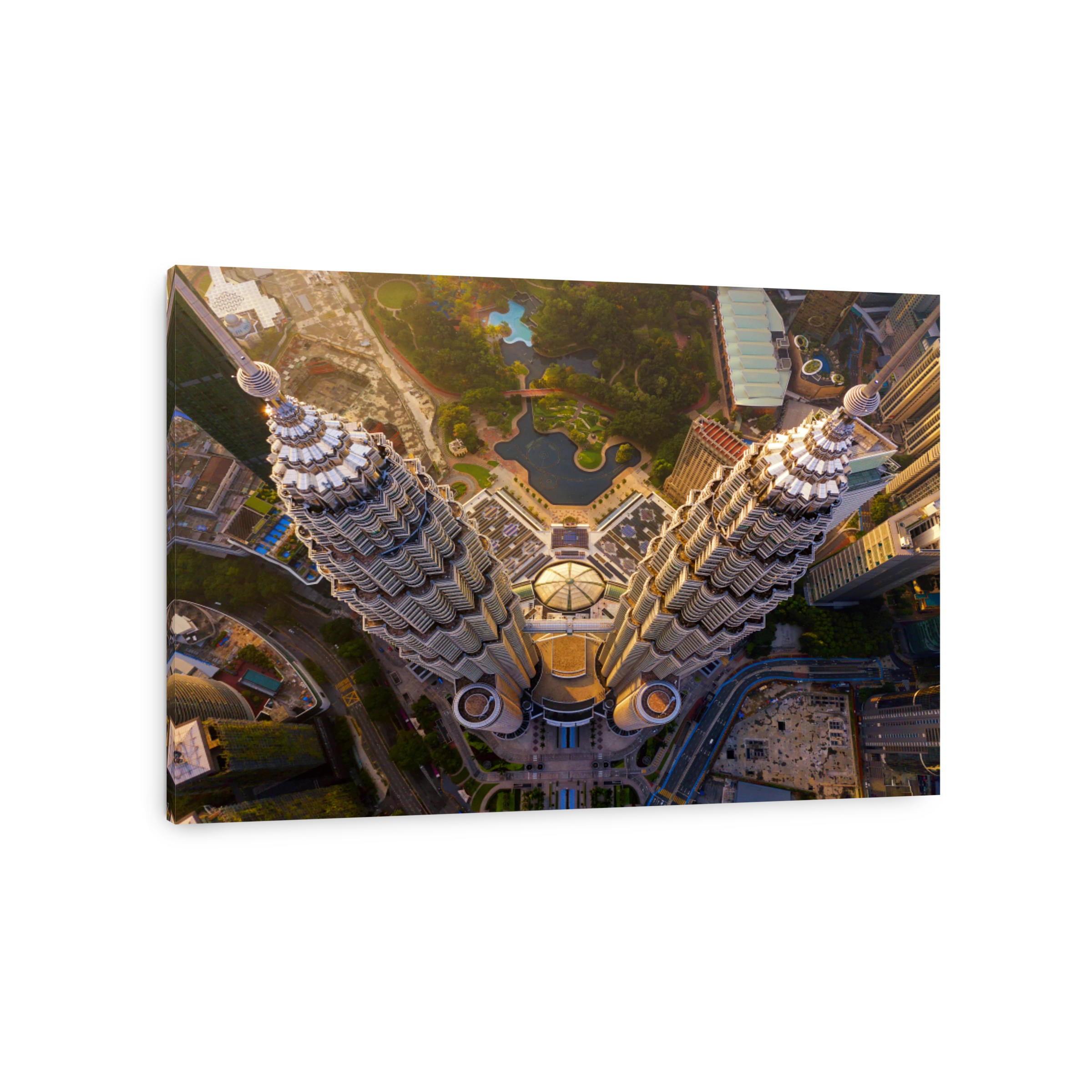 Top of Petronas Twin Towers. Aerial view of Kuala Lumpur Downtown, Malaysia. Financial district and business centers in smart urban city in Asia. Skyscraper and high-rise buildings at sunset.