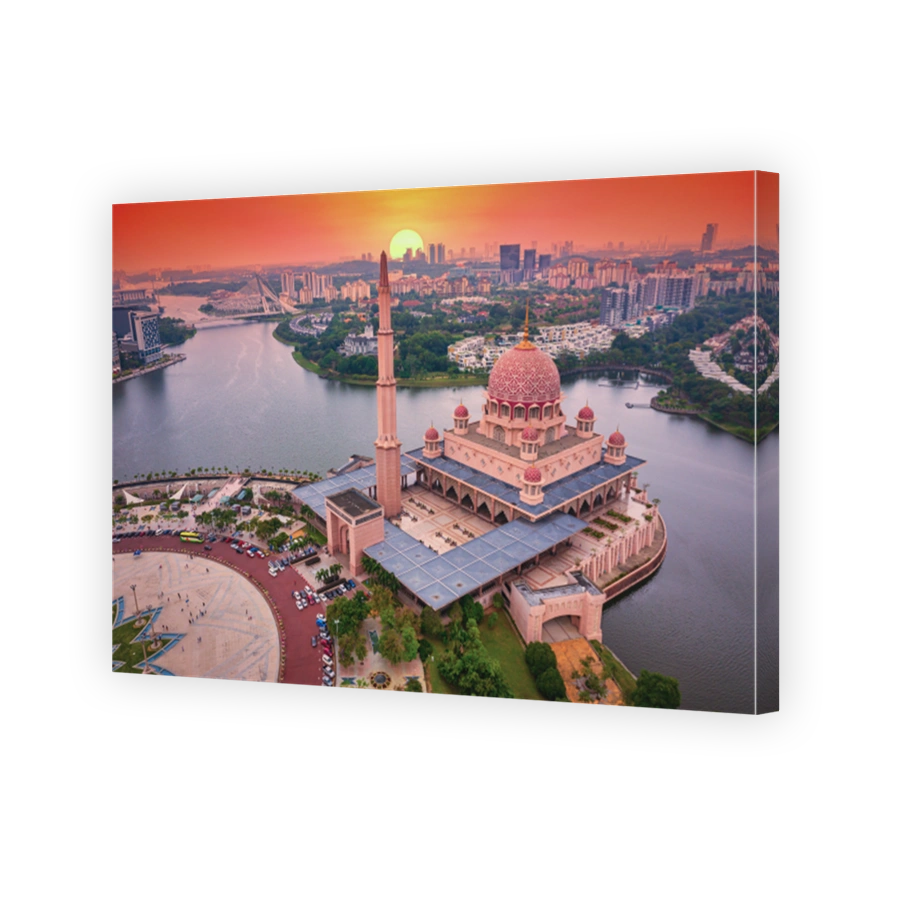 Aerial View Of Putra Mosque with Putrajaya City Centre with Lake at sunset in Putrajaya, Malaysia.