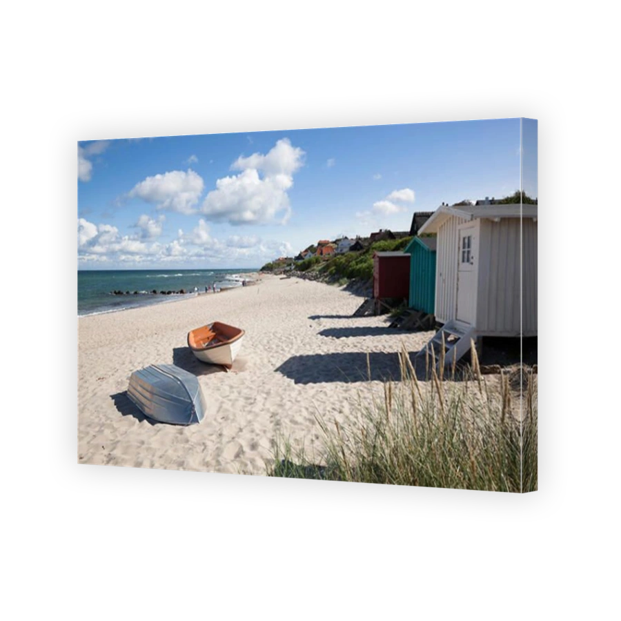 Boats and beach huts on white sand beach with town behind, Tisvilde, Kattegat Coast, Zealand, Denmark, Scandinavia, Europe