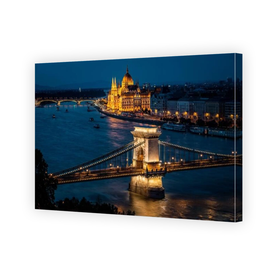 Budapest, Hungary, view of the Hungarian Parliament building and Szechenyi Chain Bridge over the Danube river at dusk.