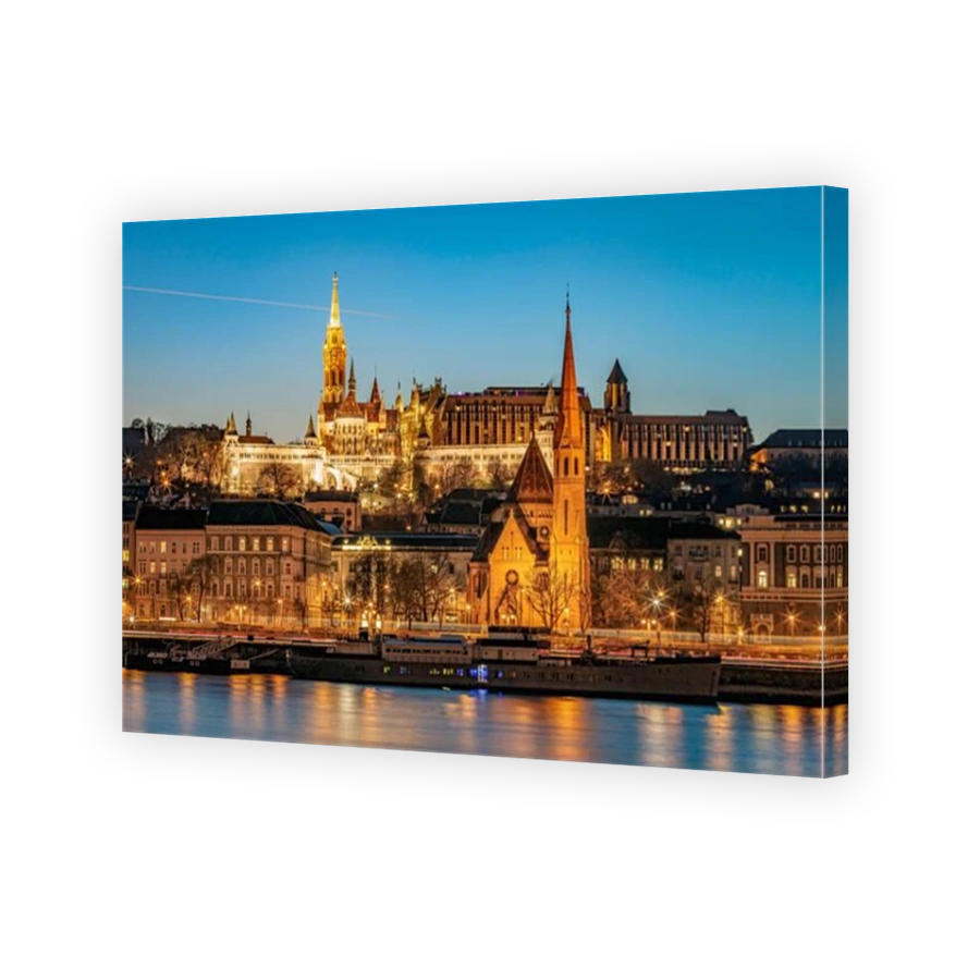 Matthias Church tower with the Fisherman Bastion and he Szilágyi Dezső Reformed Church illuminated at the blue hour. Photo taken on 24th January 2025