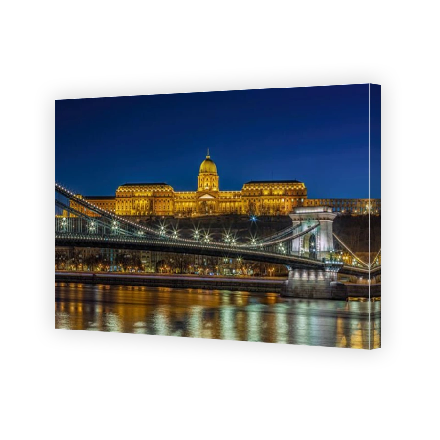 Buda Castle and the Chain Bridge illuminated at the blue hour. Photo taken on 24th January 2025 in Budapest, Hungary.