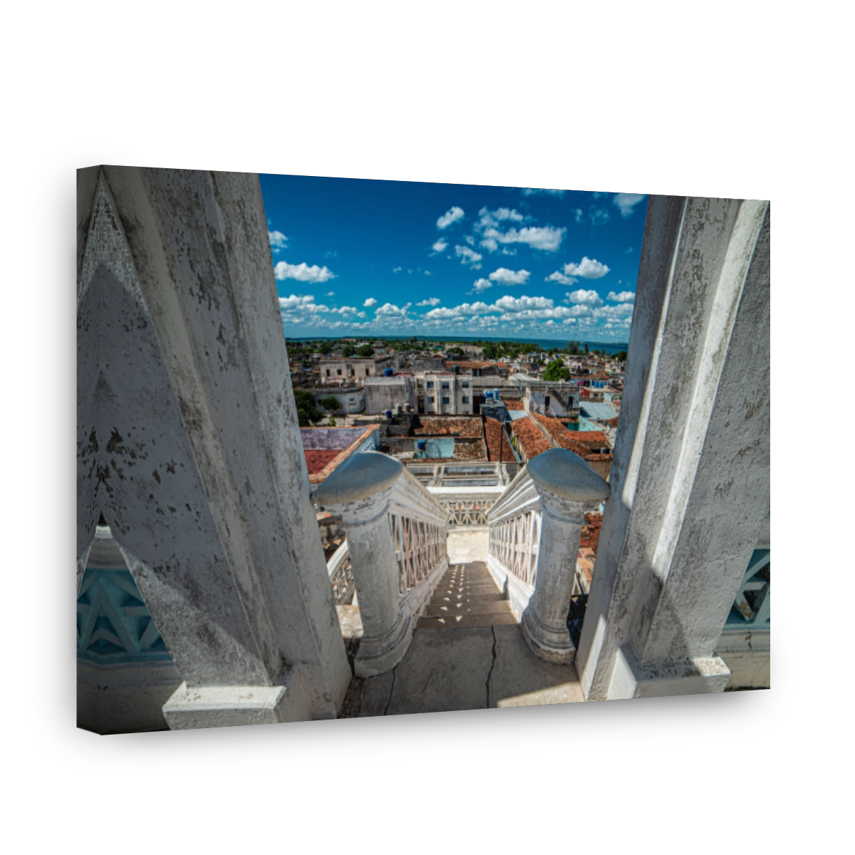 High angle shot of white stairs leading down to Cienfuegos city in Cuba