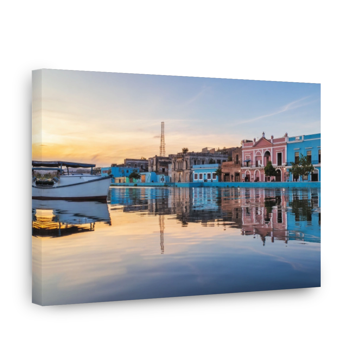 Colonial buildings and boat at sunset in Matanzas.
