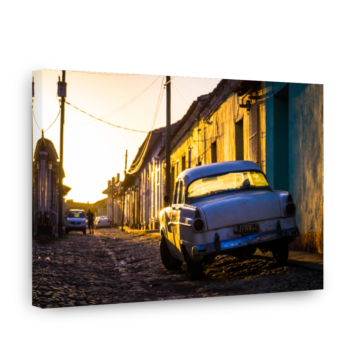 Trinidad, Cuba: Street with oldtimer at sunset