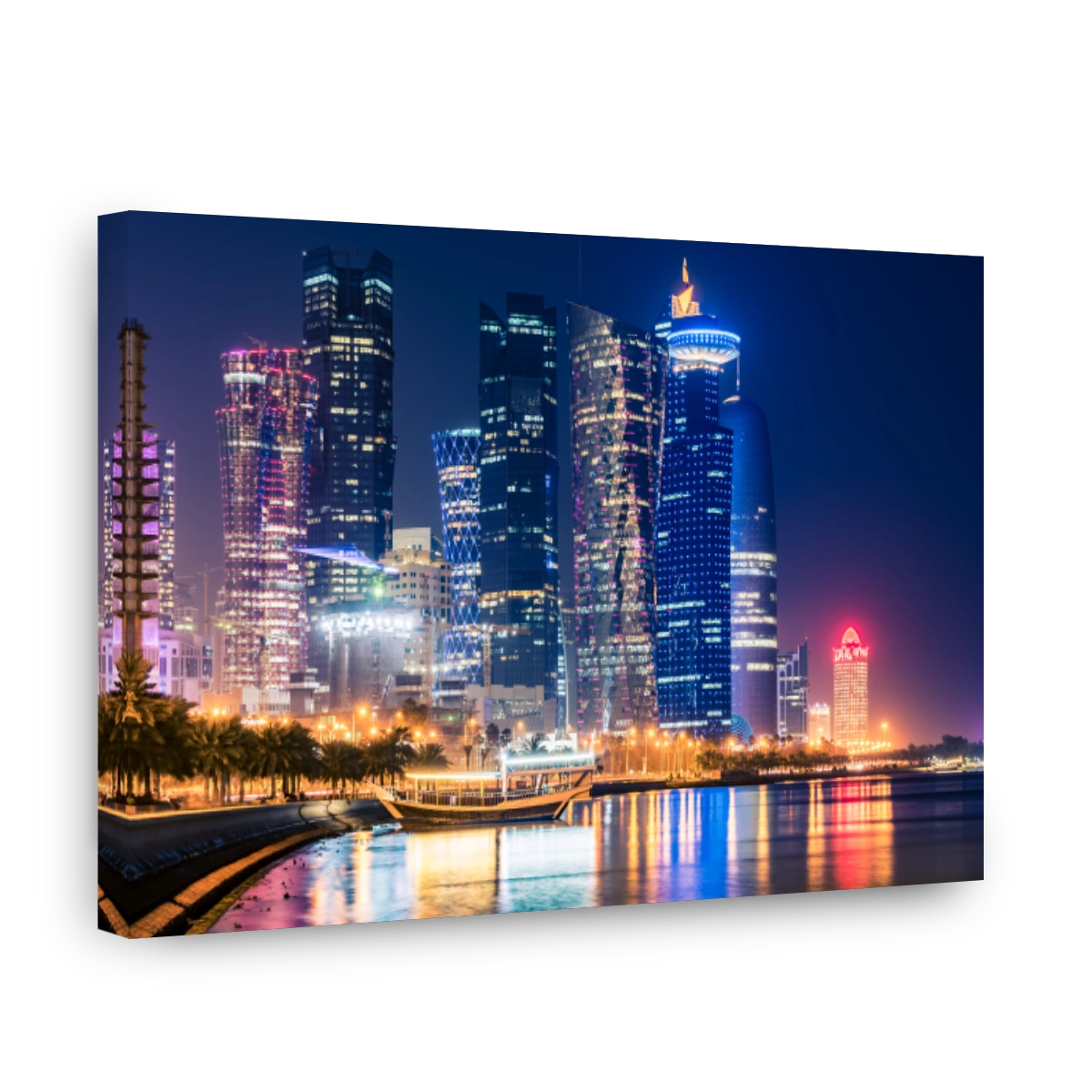 Night view on the centre of the city Doha, Qatar with many modern luxury building and skyscrapers illuminated with bright lights.