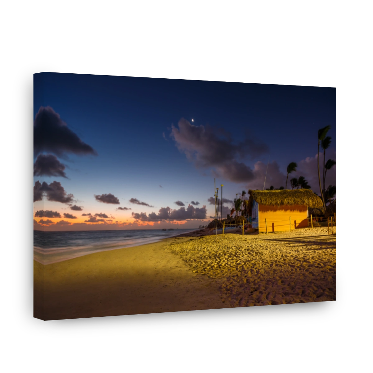 Mystic sunrise with moon and stars in the sky over the sandy beach in Punta Cana, Dominican Republic