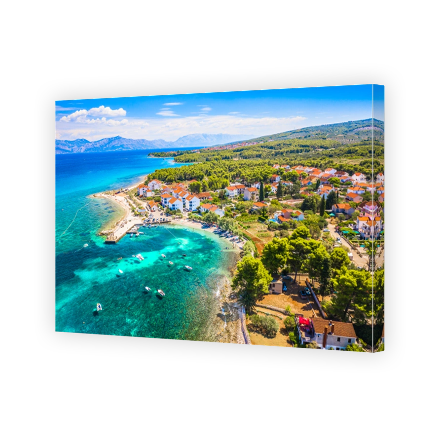 Peaceful coastal village with stone houses and Adriatic shoreline