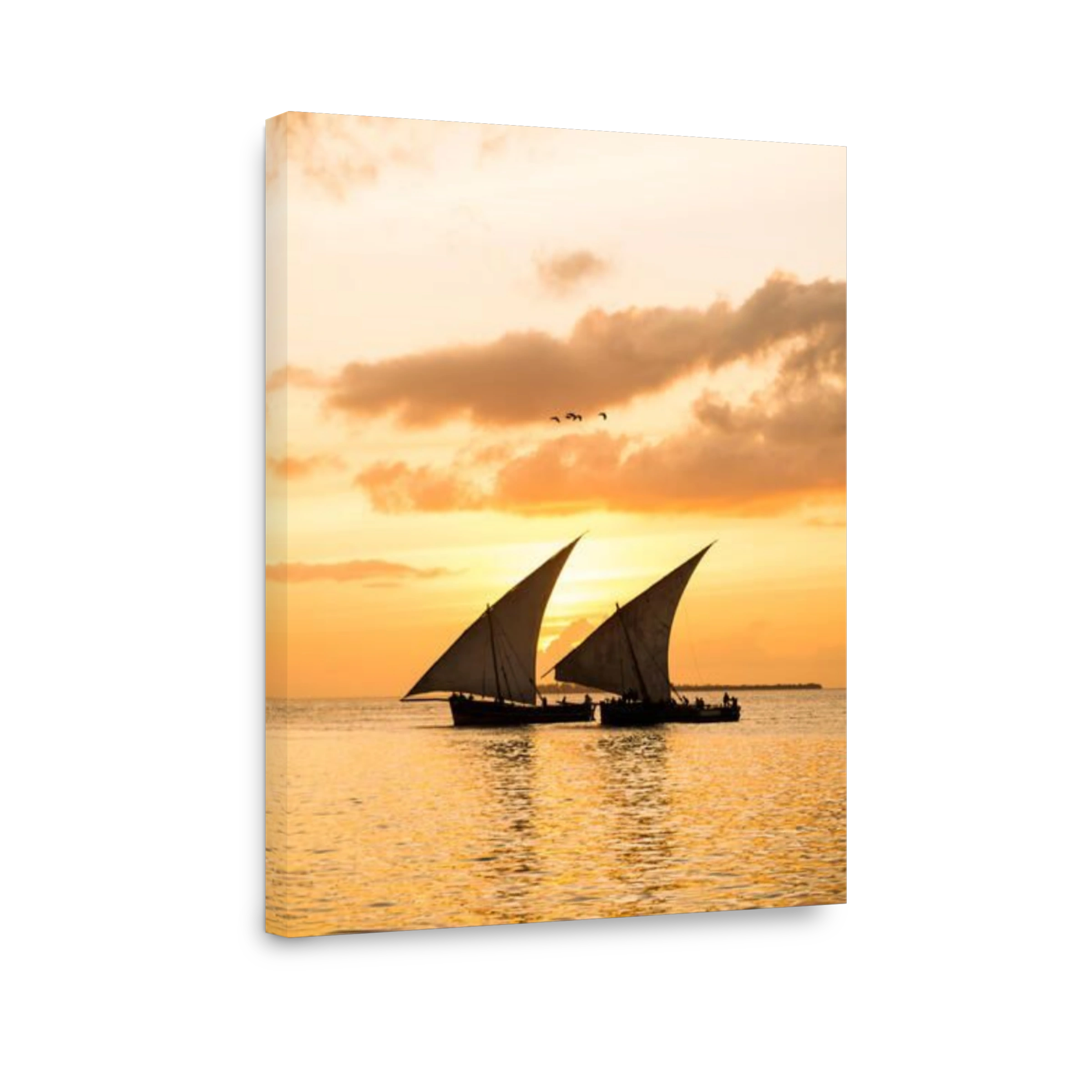 Two traditional Tanzanian dhow boats on open sea on Indian Ocean close to Stone Town on Zanzibar, at orange sunset.
