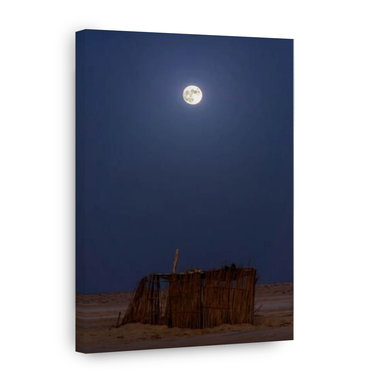 The bridght full moon over the wooden house in the middle of Sahara desert at southern Tunisia.