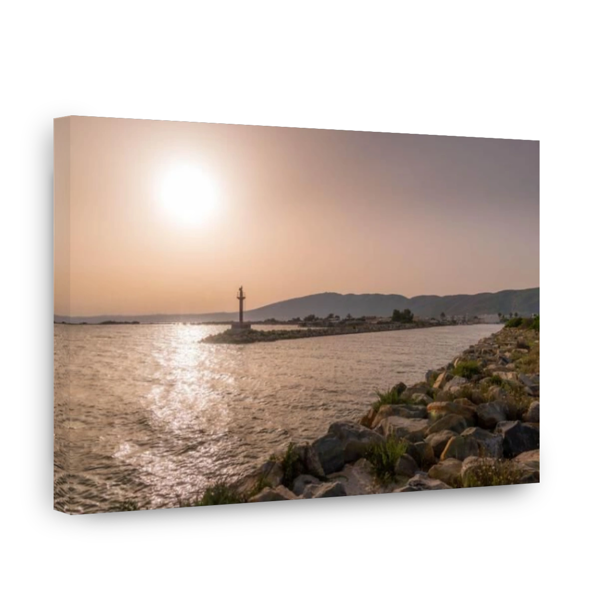 Sunset above the bay and the beacon at Ghar El Mehl, Tunisia.