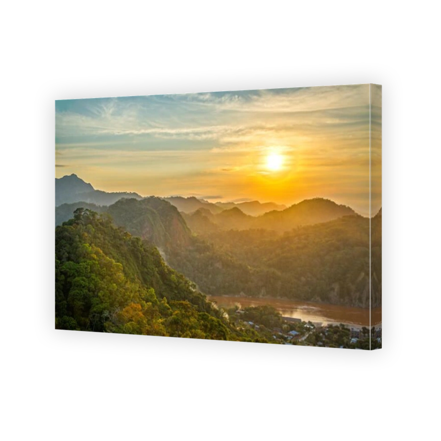 Sunset over lush green jungle covered hills with the Beni River visible in Rurrenabaque, Bolivia