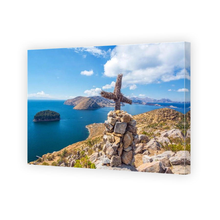 Cross on a hill with Lake Titicaca in the background taken from Isla del Sol in Bolivia