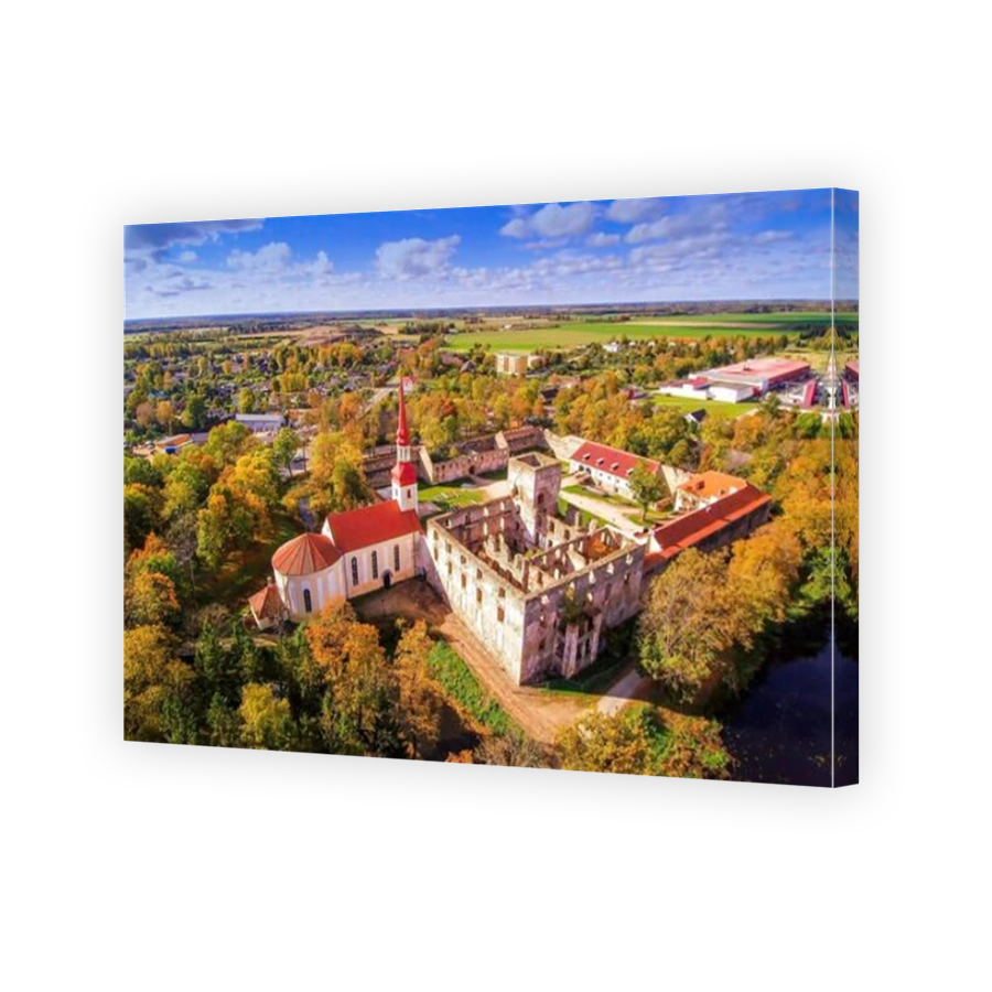 The aerial view of the ruins of the castle. The Polstamaa castle found in the middle of the trees surrounding it