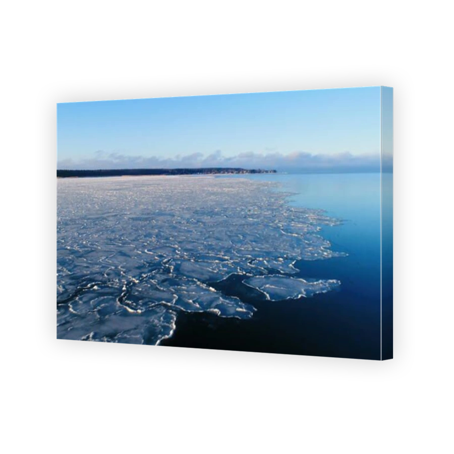 The icy sea water freezing from the snow season in Kasmu Laheema in Estonia in an aerial view