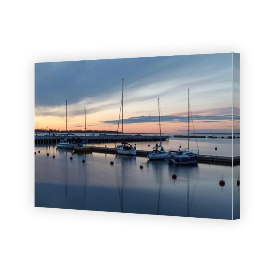 TALLINN, ESTONIA - APRIL, 22, 2020: A new residential area at Port Noblessner. Spring sunset time. Yachts in the port