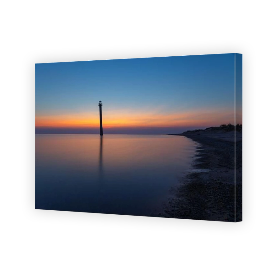 Kiipsaare lighthouse in Saaremaa, Estonia. Iconic local landmark - skew abandoned lighthouse. Sunset with a red colored sky.